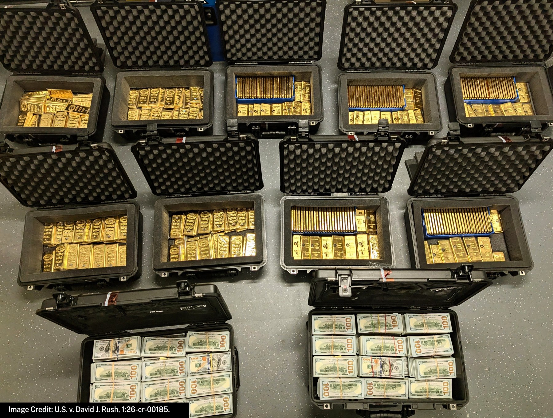 Open black evidence cases filled with gold bars and bundles of hundred-dollar bills recovered from David Rush’s home