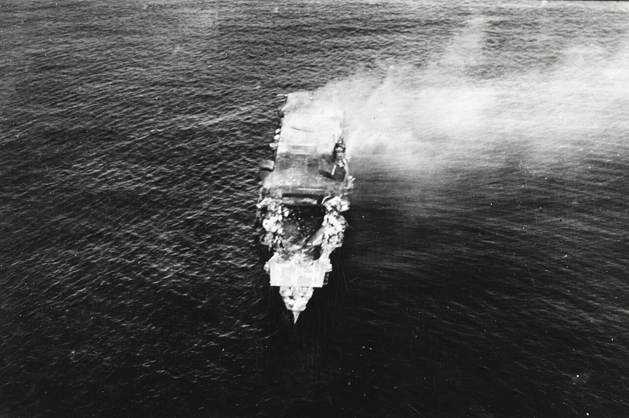The shattered Japanese aircraft carrier Hiryu burning after the Battle of Midway